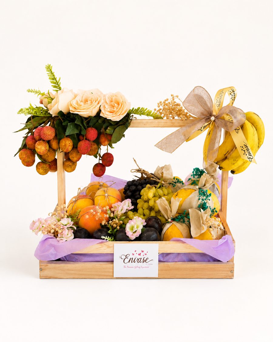 Envase hand-tied fruit gift basket with roses and ribbon