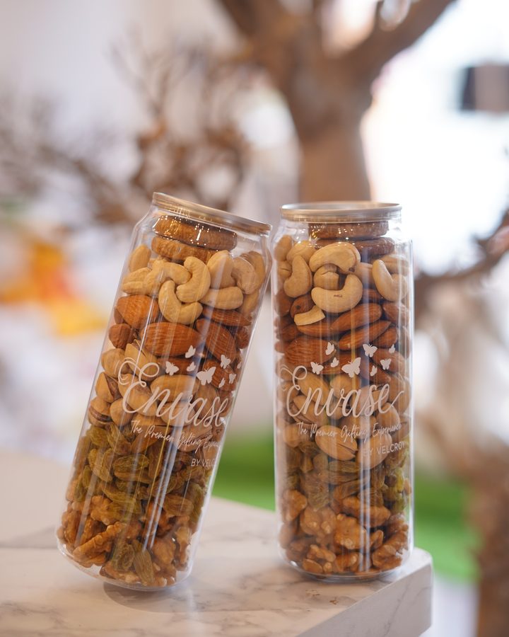 Envase canned dry fruits — premium nuts sealed in branded clear cans